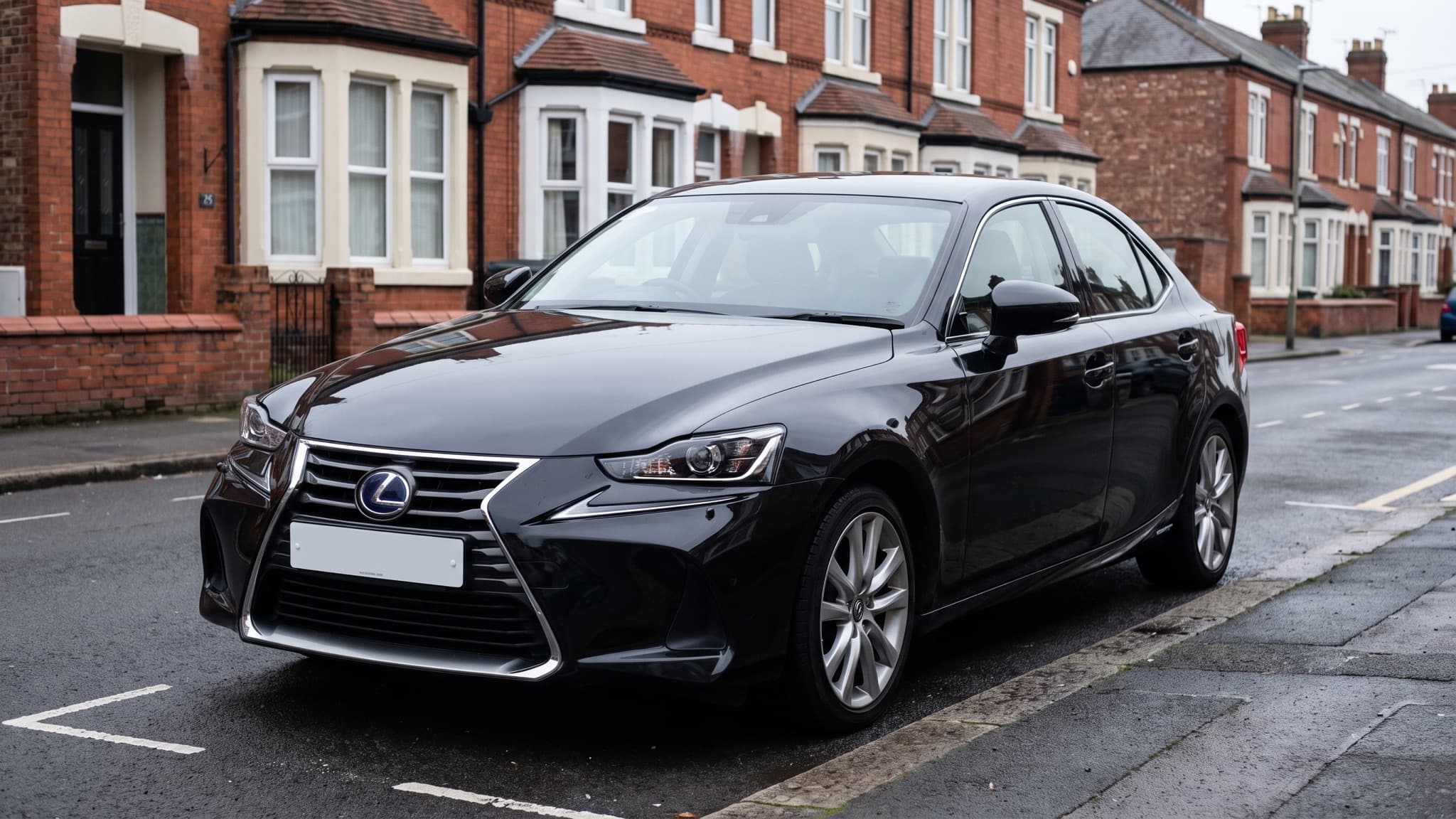 A black Lexus IS hybrid saloon parked on a UK residential street