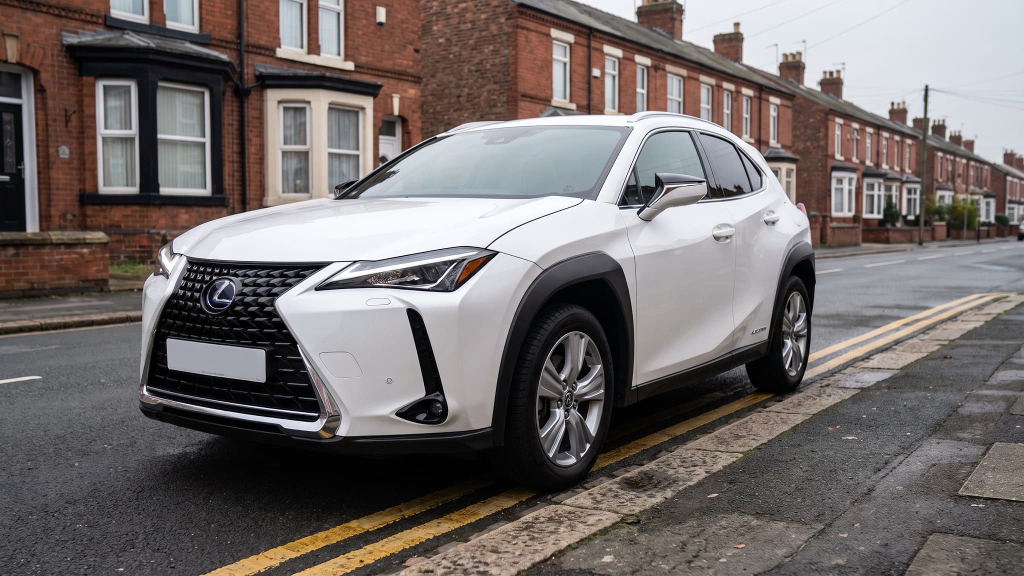 A pearl white Lexus UX hybrid parked on a UK residential street